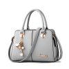 custom grey leather handbag with metal logo
